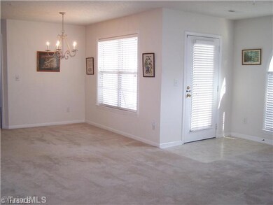 Entry. Entry from the patio into the living room and dining room area.