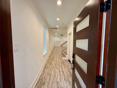 This photo showcases a modern entryway with wood-l