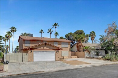 View of front of home featuring fence, stucco sidi