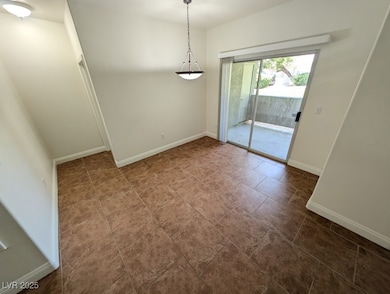 Unfurnished dining area with baseboards