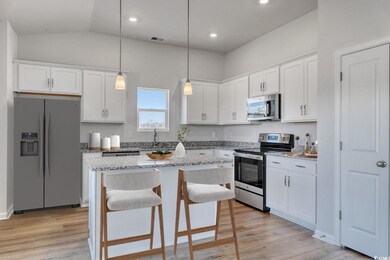 Kitchen featuring visible vents, stainless steel a