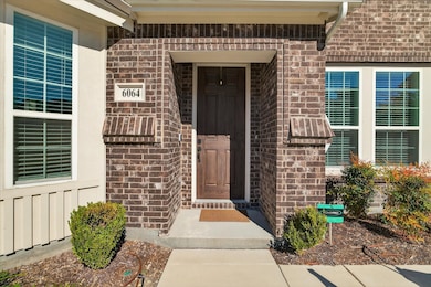 Doorway to property with brick siding