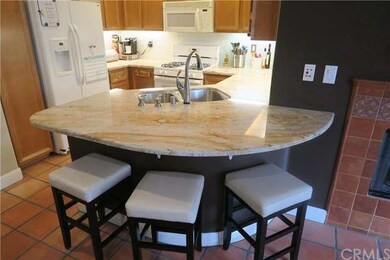 Beautiful granite countertops and breakfast bar.