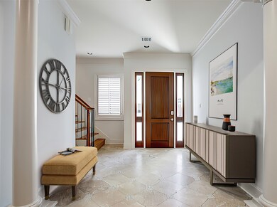 ENTRY - Light-filled entry with stone floor, inlaid accents.  Front wood door features glass sidelites.  (Virtually staged​​‌​​​​‌​​‌‌​​​‌​​‌‌​‌‌‌​​‌‌​‌‌‌​‌​​​‌‌​ photo.)