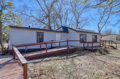 Back of property featuring a wooden deck