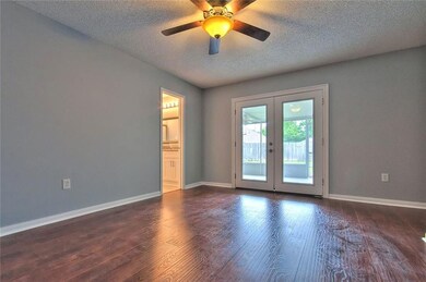 Master Bedroom.  Double doors lead to screened in