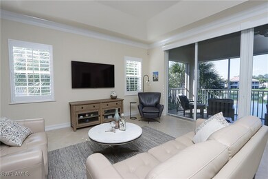 Tiled living room featuring crown molding
