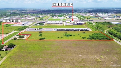 Aerial view of property and surrounding area featuring property boundaries highlighted