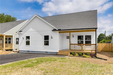 View of front of house featuring crawl space, a sh