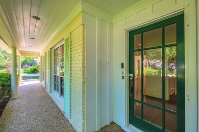 From the driveway, the pebbled front porch walkway