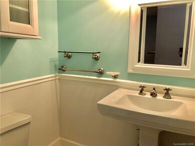 Updated powder room downstairs with white hexagon 