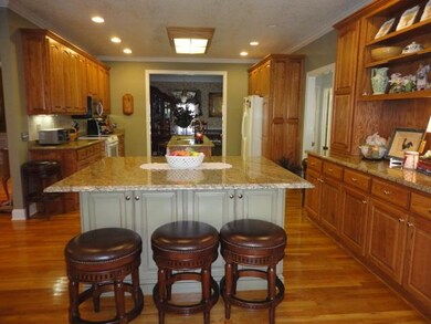 The kitchen 21x15. This kitchen will make you feel like you have just gone to heaven with its abundant granite counters and the elegant granite island. 