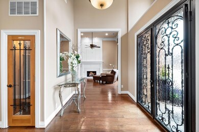 Foyer Area Entrance with Wine Cellar and Formal Living Room to the Right