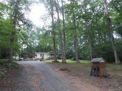 Gravel driveway up to the house.