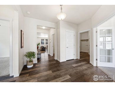 Welcoming entry with engineered wood flooring on main.