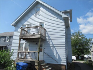 Rear view of property featuring balcony