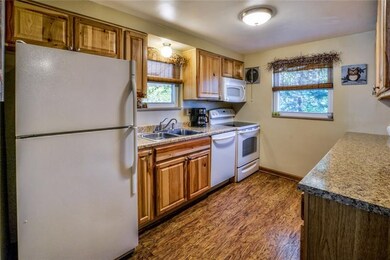 The fully equipped kitchen has ample cabinet and c