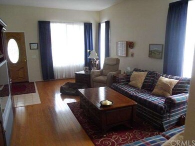LIVING ROOM FROM FAMILY ROOM TOWARD FRONT DOOR.