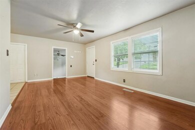 Spare room featuring ceiling fan, wood finished fl
