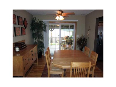 Dining Area. Gleaming hardwood flooring, sliders t