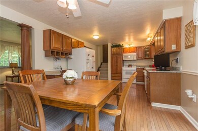 KITCHEN/DINING VIEW SHOWING STAIRWAY LEADING TO UP