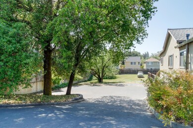 5 paved parking spaces plus third acre for parking overflow