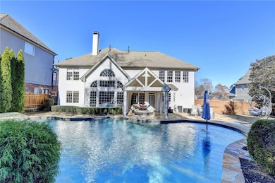 View of pool featuring a patio area, a fenced back