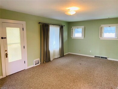 Spacious living room complete with plantation shut