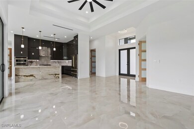 Unfurnished living room featuring light marble fin
