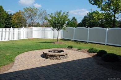 Fenced in yard, patio w/ pit