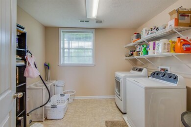 Spacious 11x11 Laundry room.
