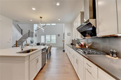 Kitchen featuring light wood finished floors, rece