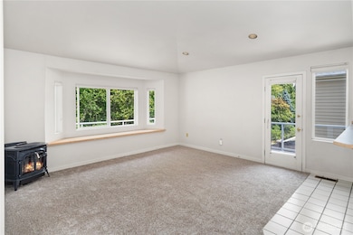 The hearth room off the kitchen with propane fireplace.