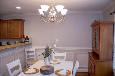 Dining with wainscoting and chair rail.