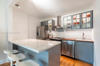 Kitchen with bar stools eating area