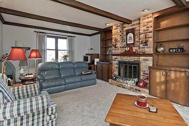 Living Room. Built in bookcases, wood burning fire