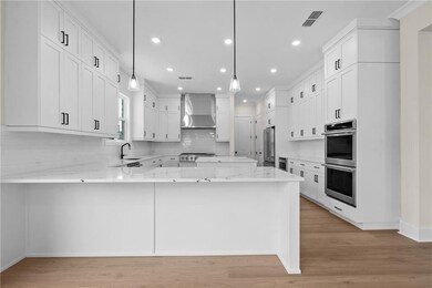 SAMPLE PHOTOS, NOT ACTUAL HOMES KITCHEN IN HOME AVAILABLE WILL BE SIMILAR, WITH TONS OF CABINETS AND A DETACHED 10' ISLAND FOR EVERYONE TO GATHER AROUND