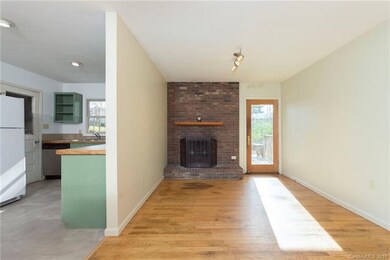 Wood burning fireplace in dining area.