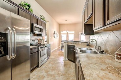 SPACIOUS KITCHEN WITH STAINLESS STEEL APPLIANCES A