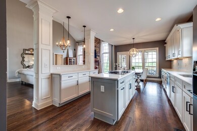 This beautiful updated white kitchen is so bright and airy! The floorplan is an open concept between the kitchen & living room. 