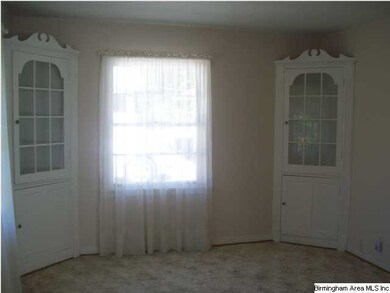 Formal Dining area with builtin cupboards.