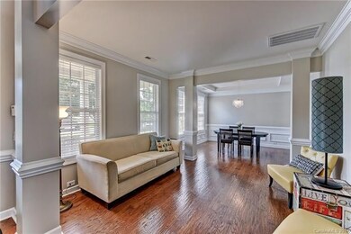 This peaceful Living Room with crown molding could