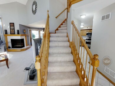 ALTERNATIVE VIEW OF LIVING ROOM - STAIRCASE TO SEC