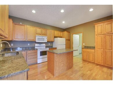 Upgraded kitchen with built-in cabinetry with pull