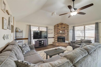 Living room featuring a fireplace, hardwood / wood