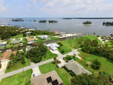 Aerial view, across the street from canal with gre