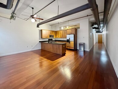 Kitchen with ceiling fan, wood-type flooring, a to
