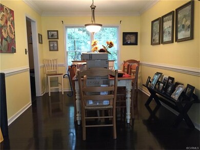 Formal dining room with wood laminate flooring, cr