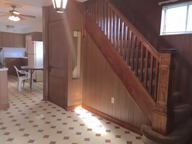 Entry of home with steps that lead to the upper le