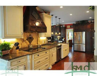 Kitchen. There is a pot filler over the cooktop. N